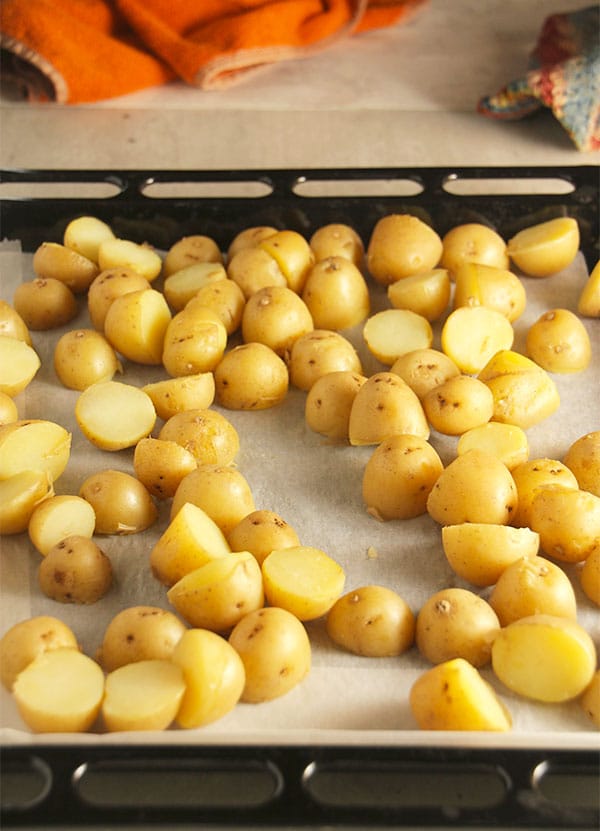 Diced potatoes on baking try ready for the oven.