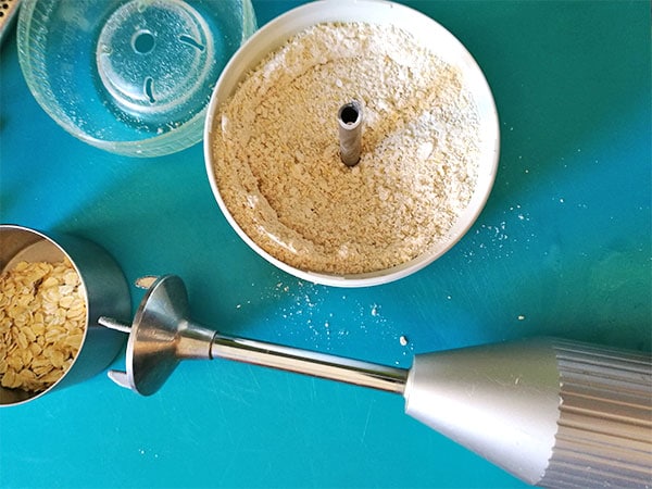 Oats are ground into a meal using a spice grinder.