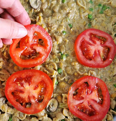 sliced tomatoes are added to plant-based "tuna" casserole