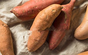 sweet potatoes are either hard with orange skin or soft with reddish skin.