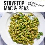 Overhead shot of stovetop mac and peas on white plate with fresh basil and vegan Parmesan on white plate. Text overlay with recipe title in black text.