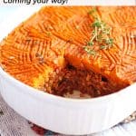 sweet potato Shepherd's pie in white casserole dish with serving cut out.