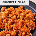 quinoa chickpea pilaf on black plate with text overlay with recipe title.