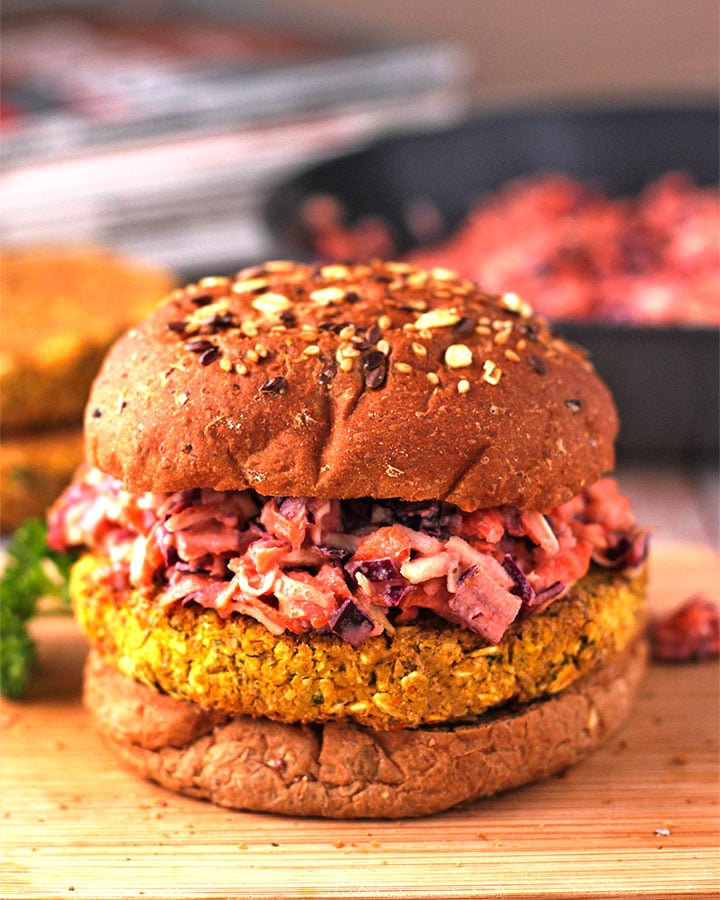 baked chickpea burgers with spicy coleslaw on board.