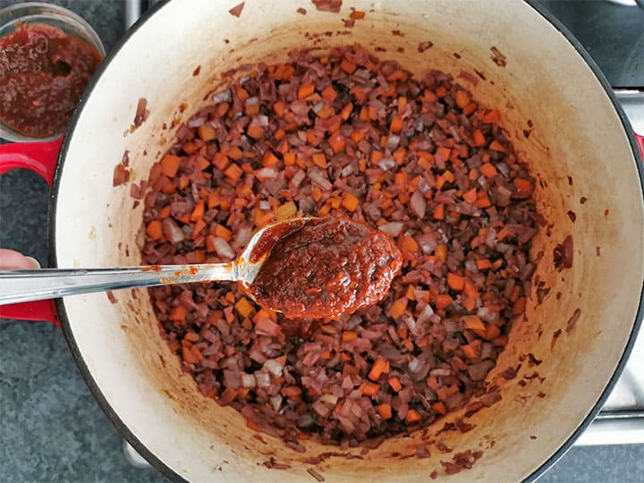 pureed chipotle peppers in adobo sauce is added to sauteed onions and carrots in red wine.