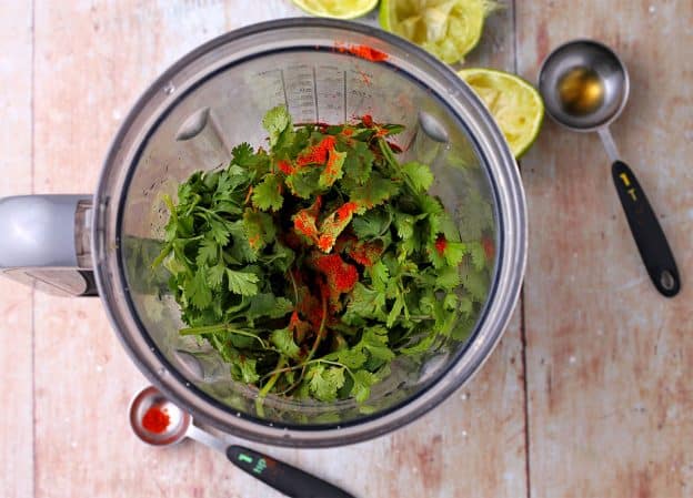 blender with cilantro and chili powder