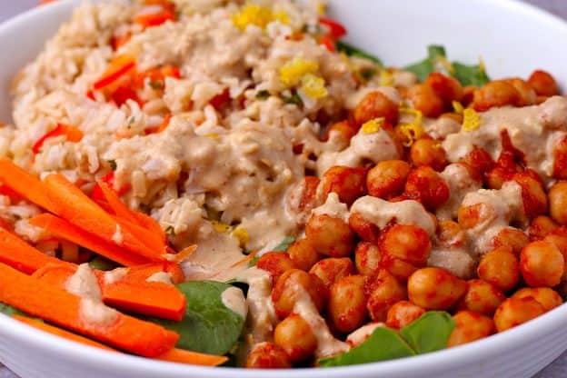 buffalo chickpeas with carrot sticks, spinach, brown rice with red peppers and scallions with ginger-tahini dressing