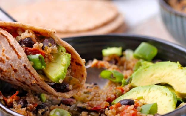 beans, quinoa, avocado and sliced scallions in a wrap over bowl of Southwestern beans and quinoa.