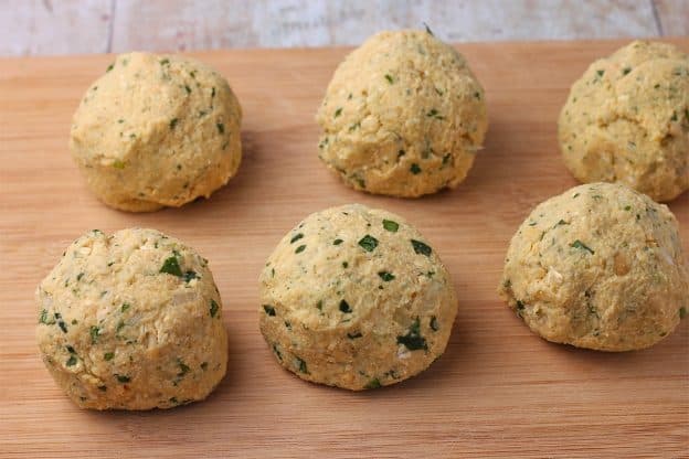 Chickpeas are blended with onions, garlic, parsley, salt, and pepper and formed into balls.