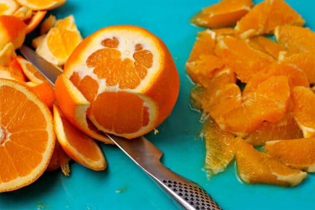 And orange is peeled using a knife.
