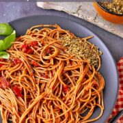 A plate of spaghetti arrabbiata with hemp parmesan.