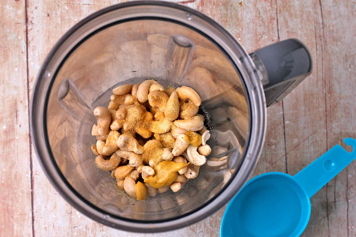 Cashews, mustard, and spices in blender.