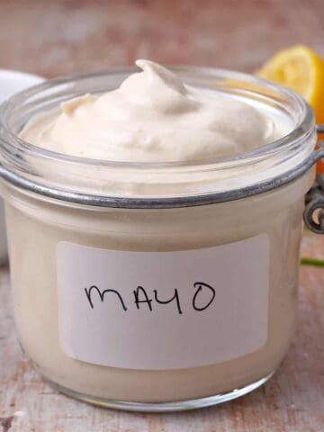 A jar with a label filled with vegan mayo.