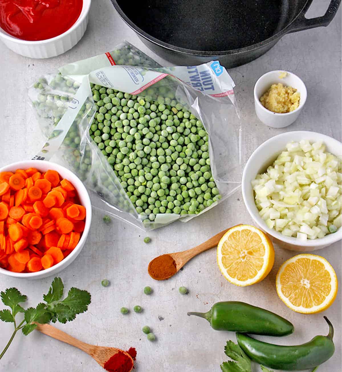 The ingredients for pea stew are laid out on a board.
