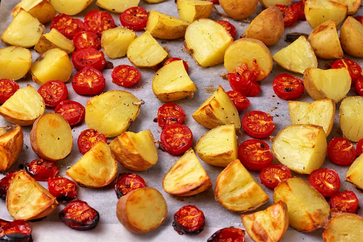 Potatoes and tomatoes are roasted.