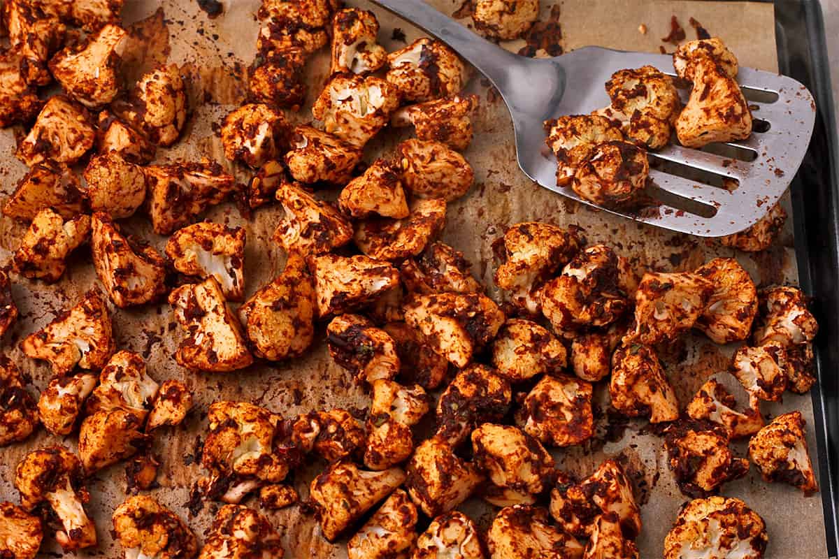 Roasted barbacoa cauliflower on a baking tray. 