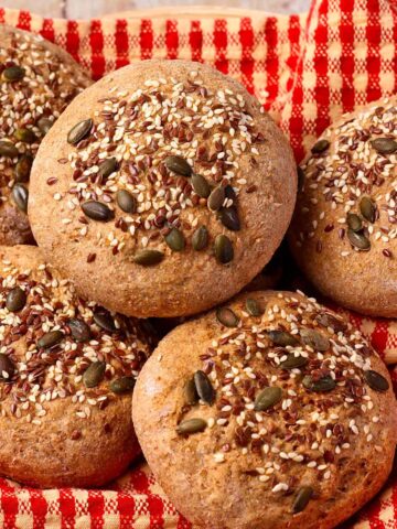 Whole wheat hamburger buns with seeds on top.