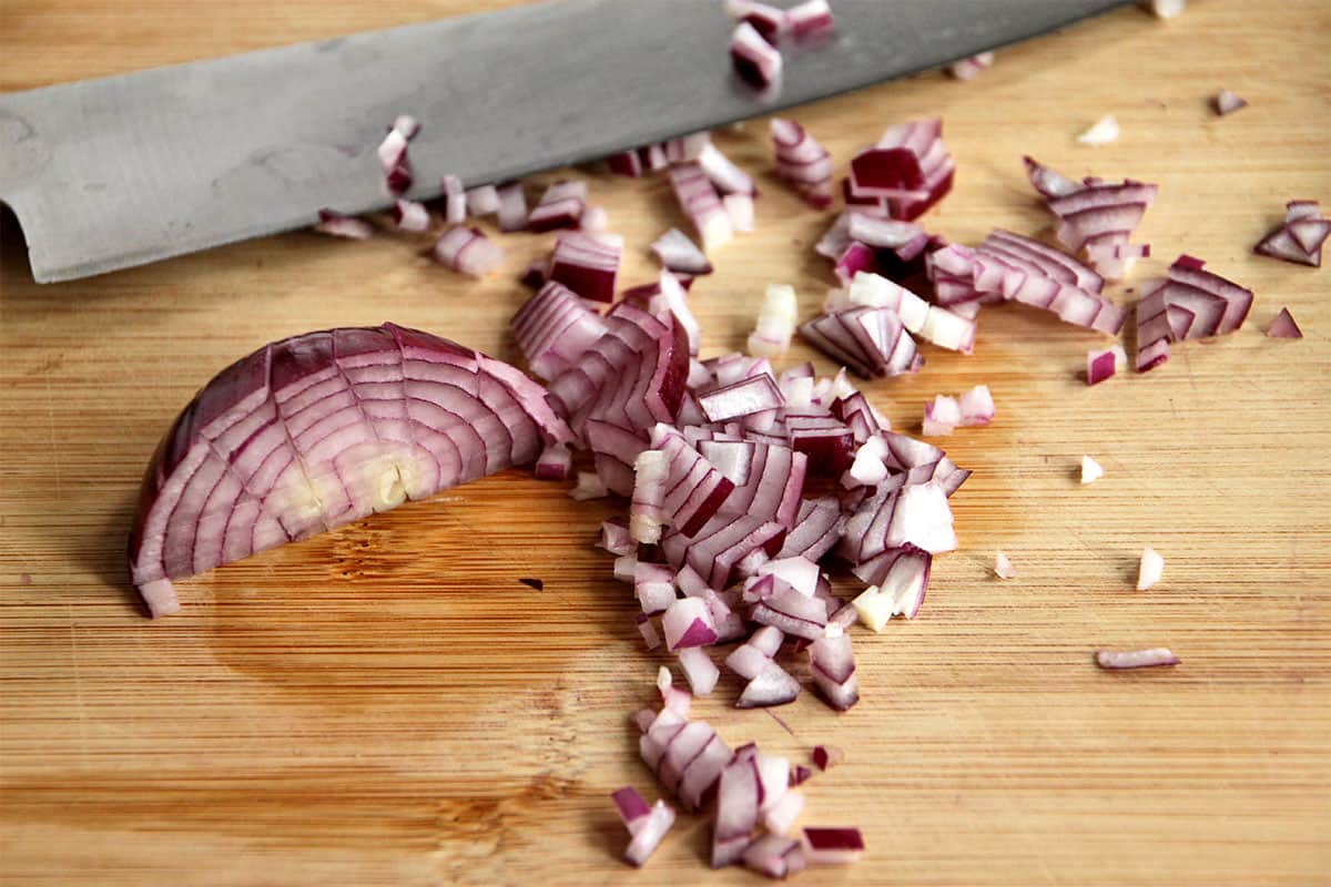 A half a red onion is diced.