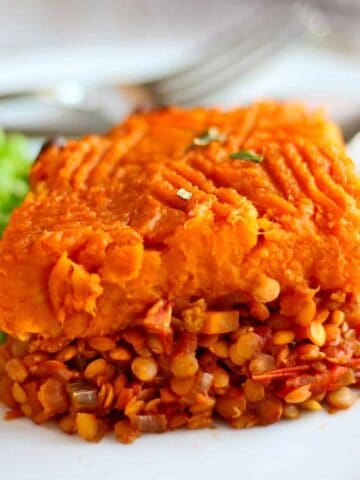 A slice of shepherd's pie with sweet potatoes and lentil filling.
