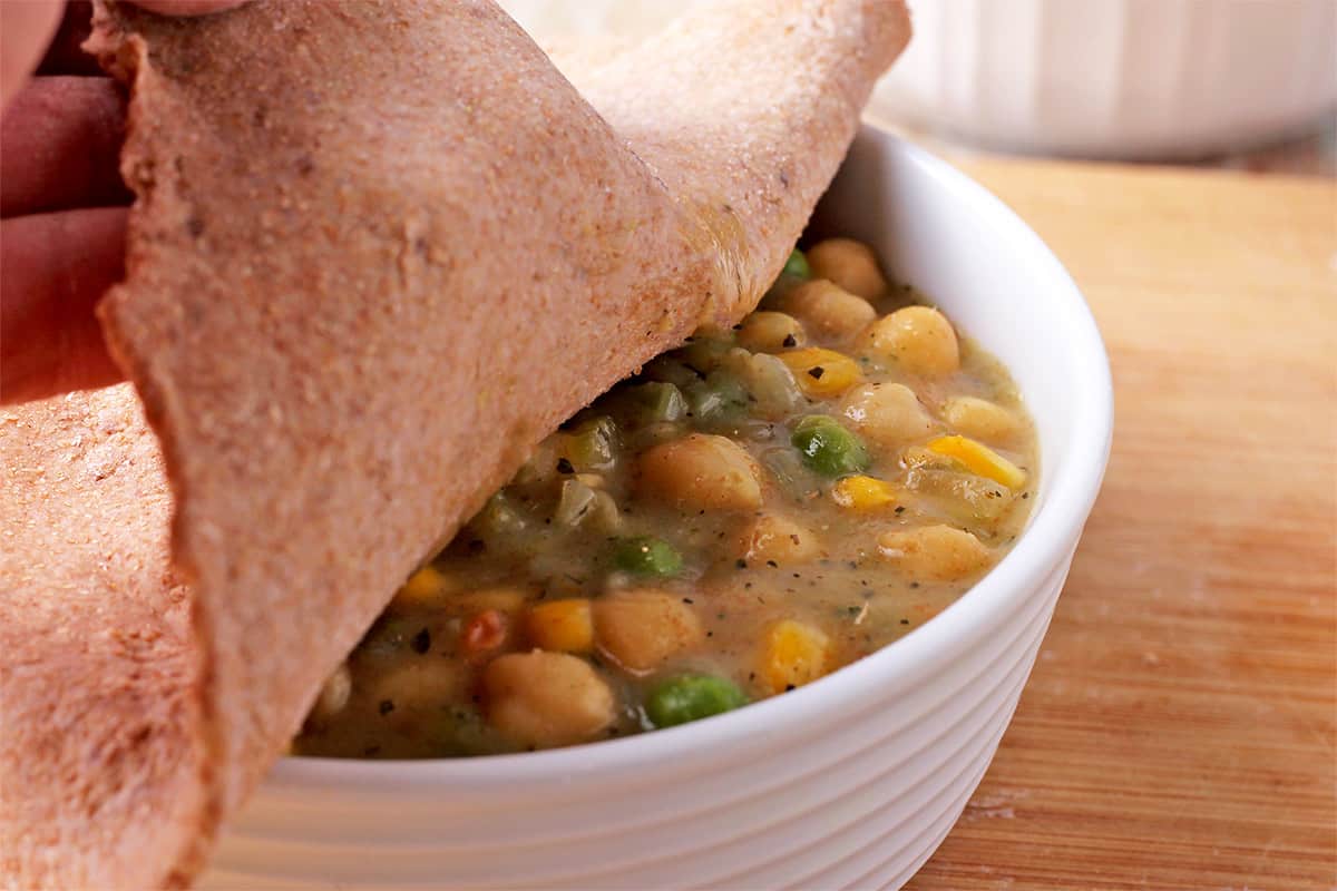 Chickpea and vegetable filling is covered with whole wheat pie crust.