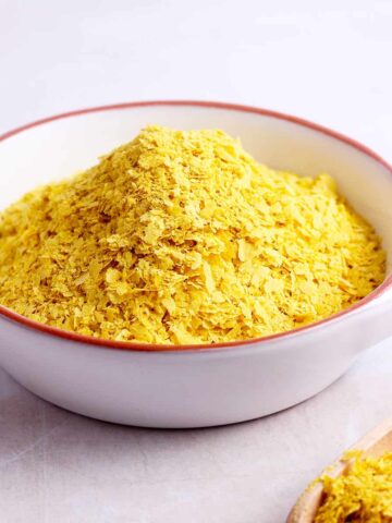 A bowl of nutritional yeast flakes.
