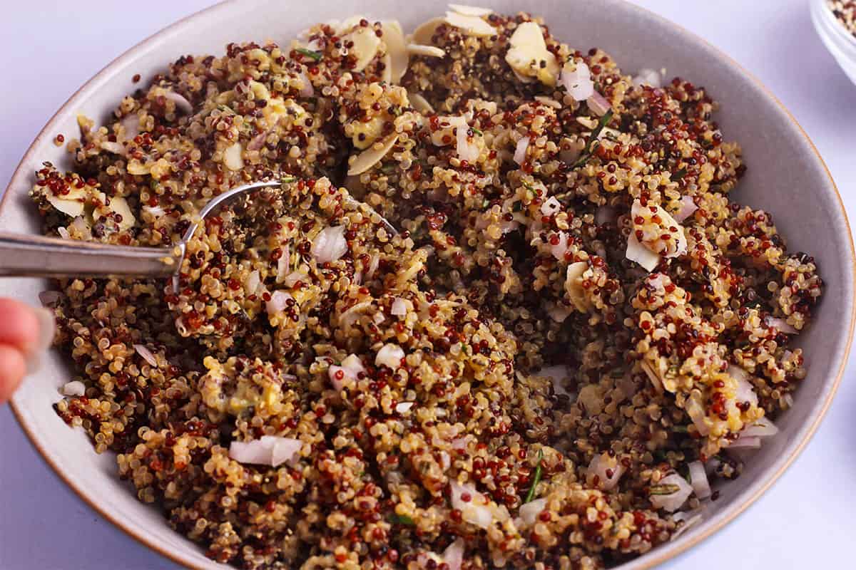 Tri-color quinoa is mixed with almonds, rosemary, and shallots.