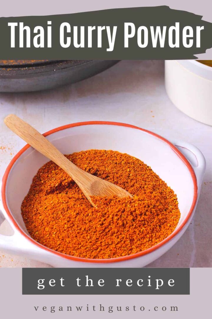 A dish of Thai curry powder with a small spoon.