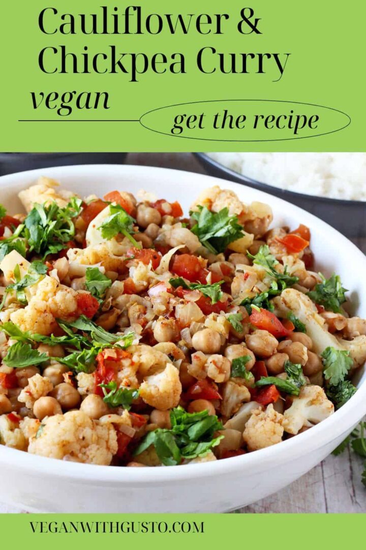 A bowl of chickpea and cauliflower curry in a white bowl.