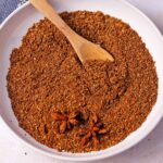A dish of garam masala with 2 star anise.