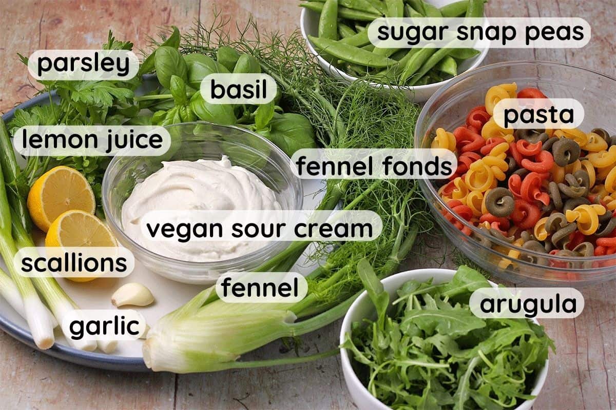 The ingredients for green goddess vegan pasta salad with labels.