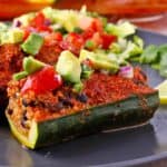 Stuffed zucchini boats with quinoa and black beans and avocado salsa.