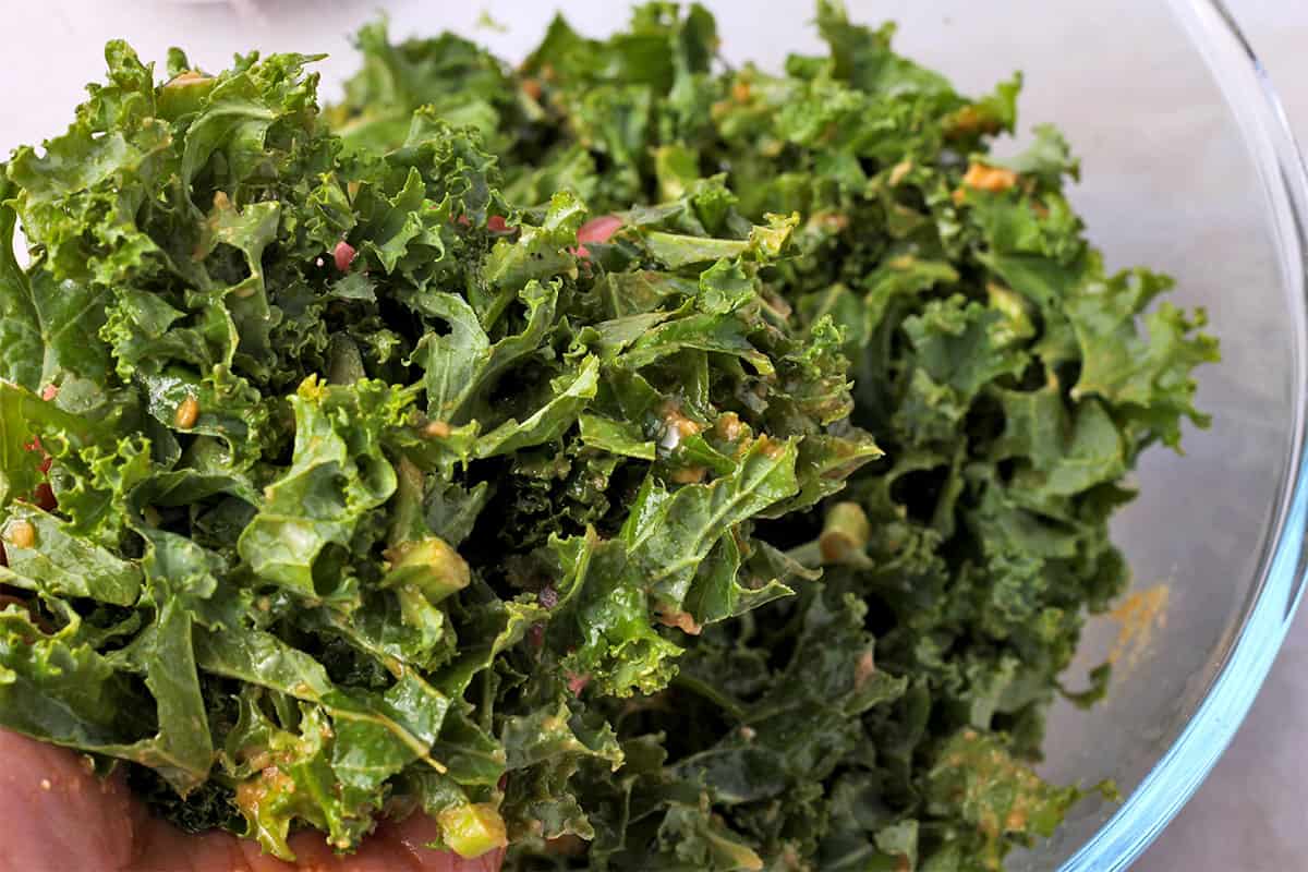 Kale is massaged with peanut dressing.