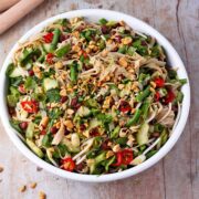Rice noodle salad with chopped veggies, peanuts, and sliced red chilies.