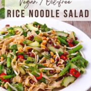 Rice noodle salad in a white bowl with text overlay of the website and recipe title.