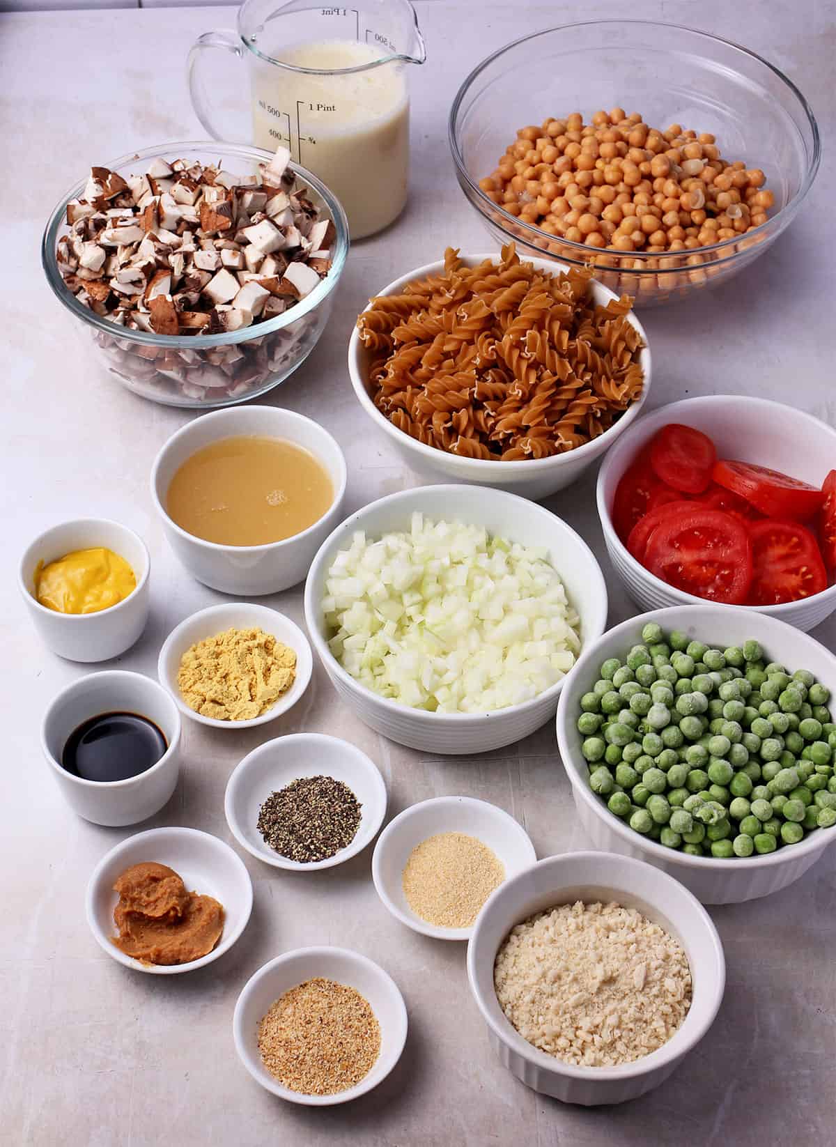 The ingredients for vegan tuna casserole in small bowls.