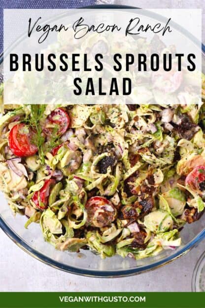 Shaved Brussels sprouts salad with vegan bacon and ranch dressing in a glass bowl with text of recipe title.