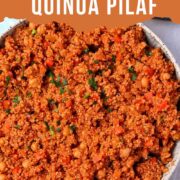 Quinoa pilaf with chickpeas and diced carrots in a bowl with text overlay of the recipe title.