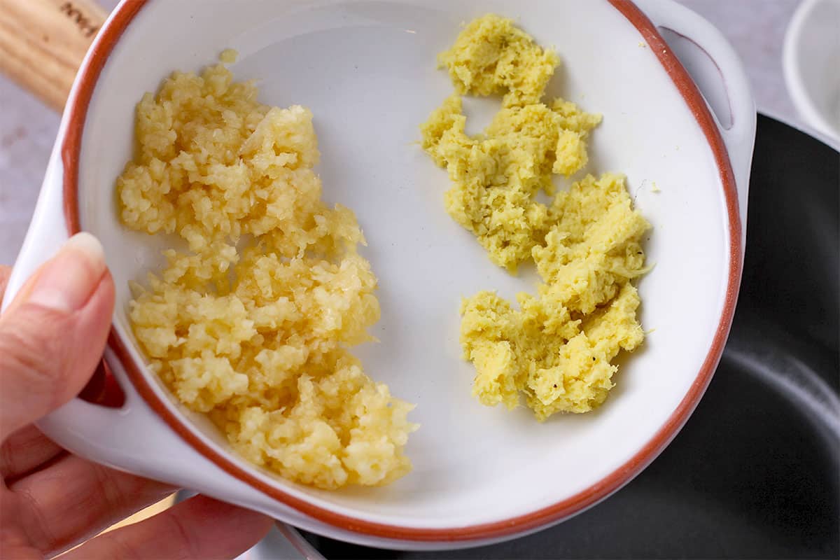 Minced ginger and garlic in a white dish.
