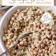 A bowl of creamy chickpea salad with a spoon and text overlay of recipe title.