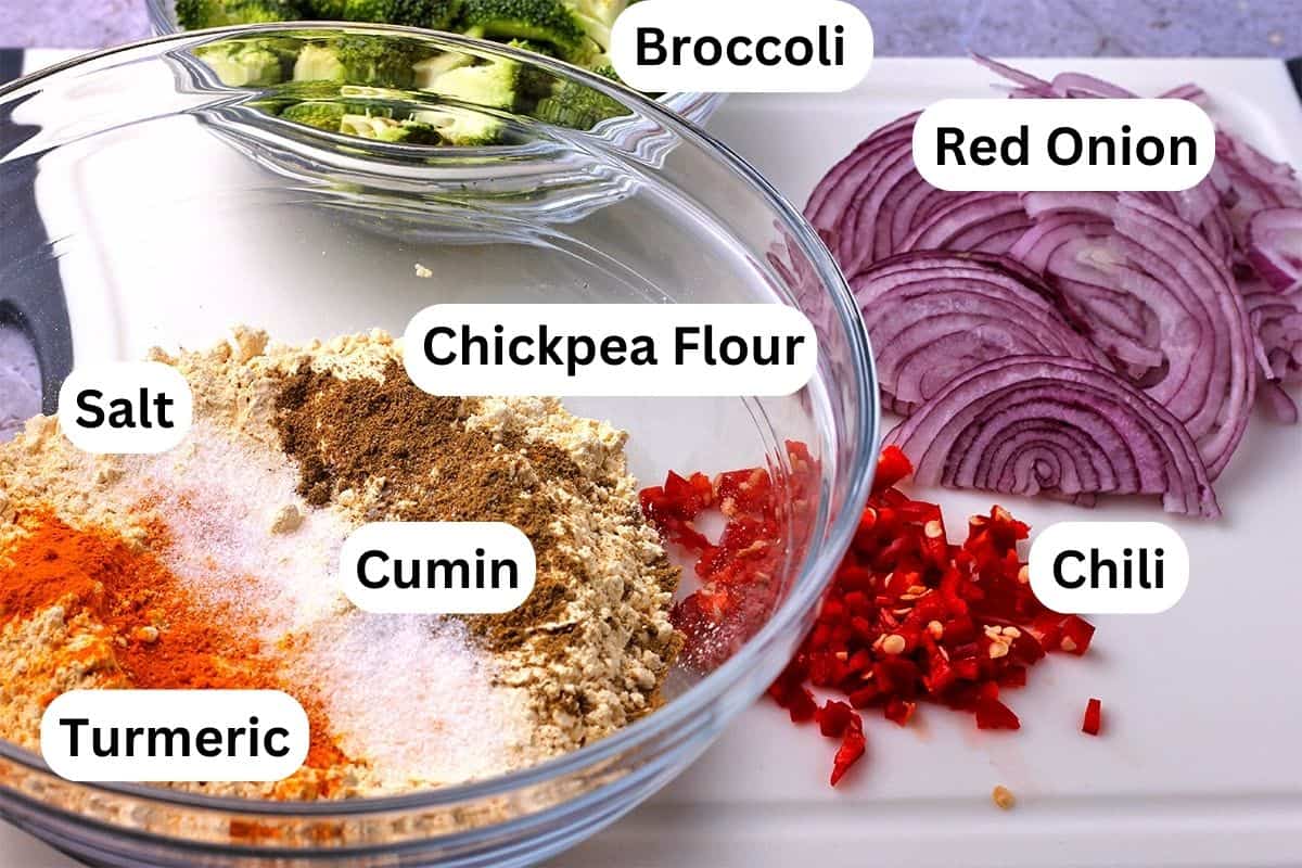 The ingredients for vegetable pakoras with broccoli and red onion. Ingredients are labeled.