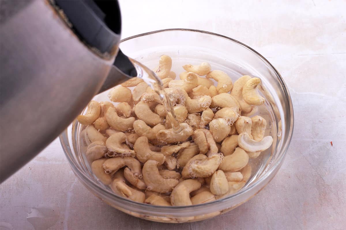 Water is poured over cashews.