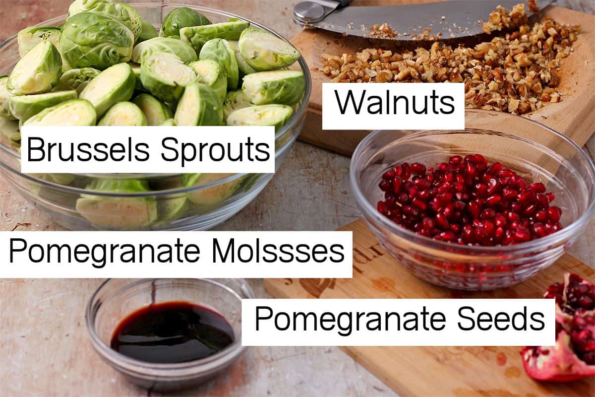 Cut Brussels sprouts, chopped walnuts, pomegranate molasses in a dish, and pomegranate seeds are arranged with labels.