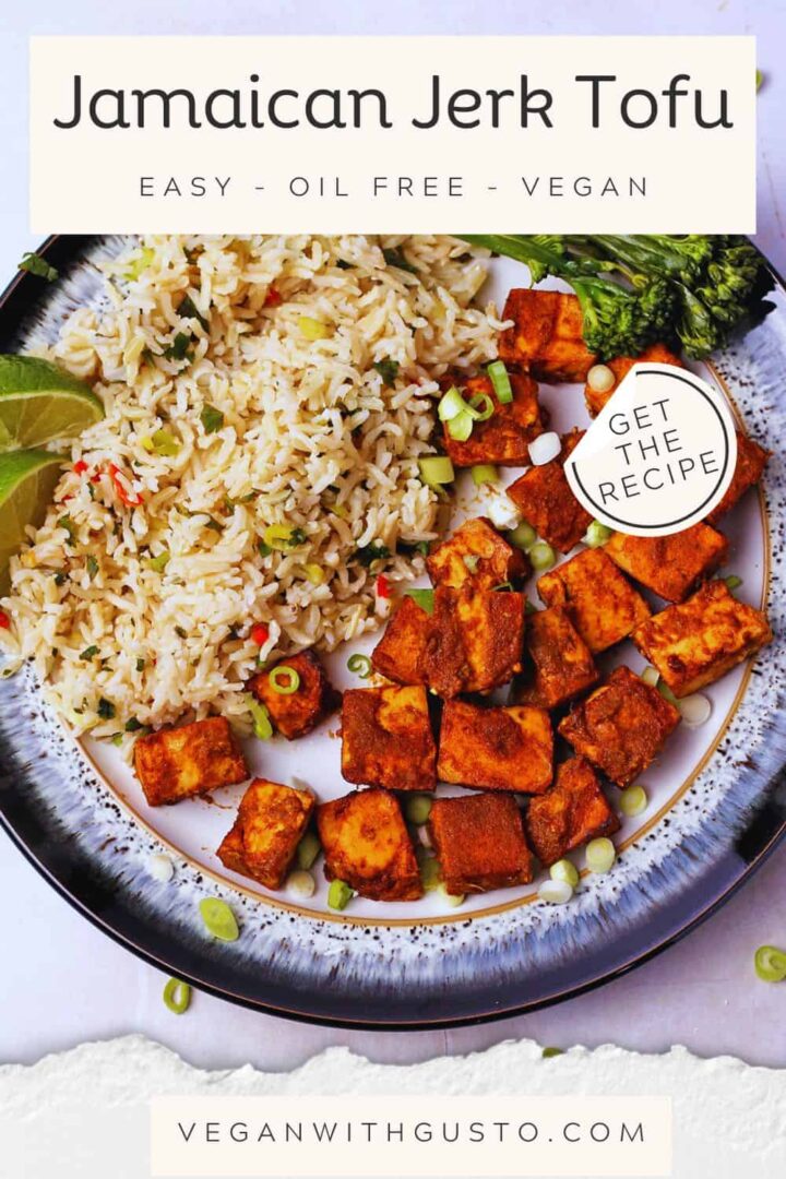 A plate with Jamaican jerk tofu with rice and broccoli. Text overlay with recipe and website included on the picture.
