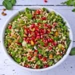 Pearl couscous salad with herbs, pomegranate seeds and pistachios.