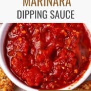 Marinara dipping sauce in a white dish with cauliflower bites. Text overlay of recipe title and website.