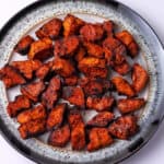 A plate of cooked tofu chicken pieces.