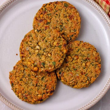 Chickpea patties on a white plate.