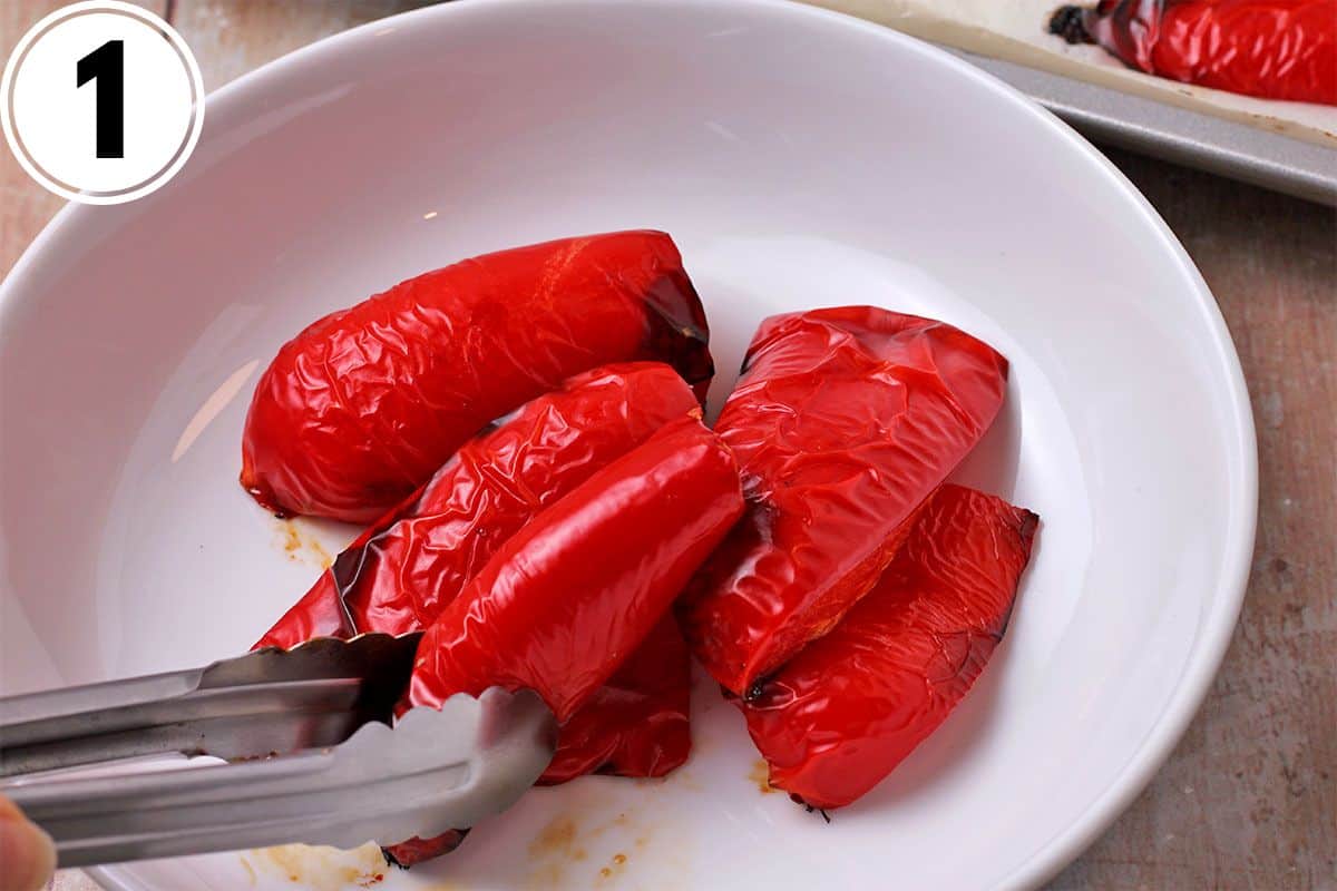 Roasted red pepper slices are placed in a white bowl.