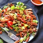 A plate of BBQ soy curls salad with avocado.