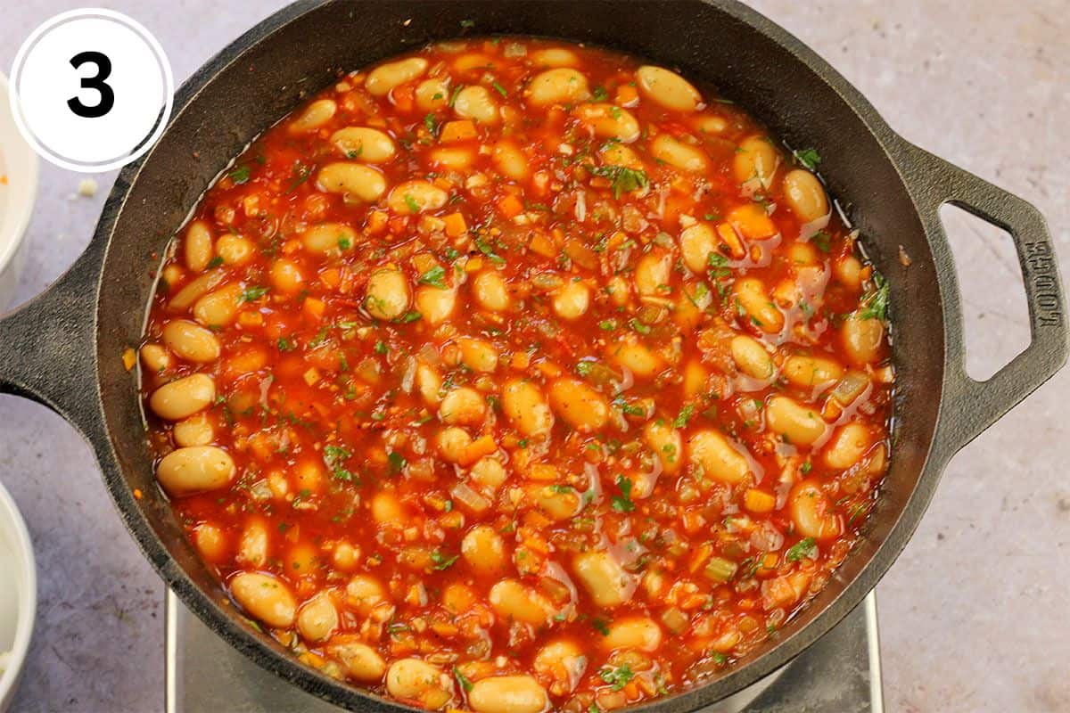 Butter beans in tomato sauce with fresh parsley and dill.
